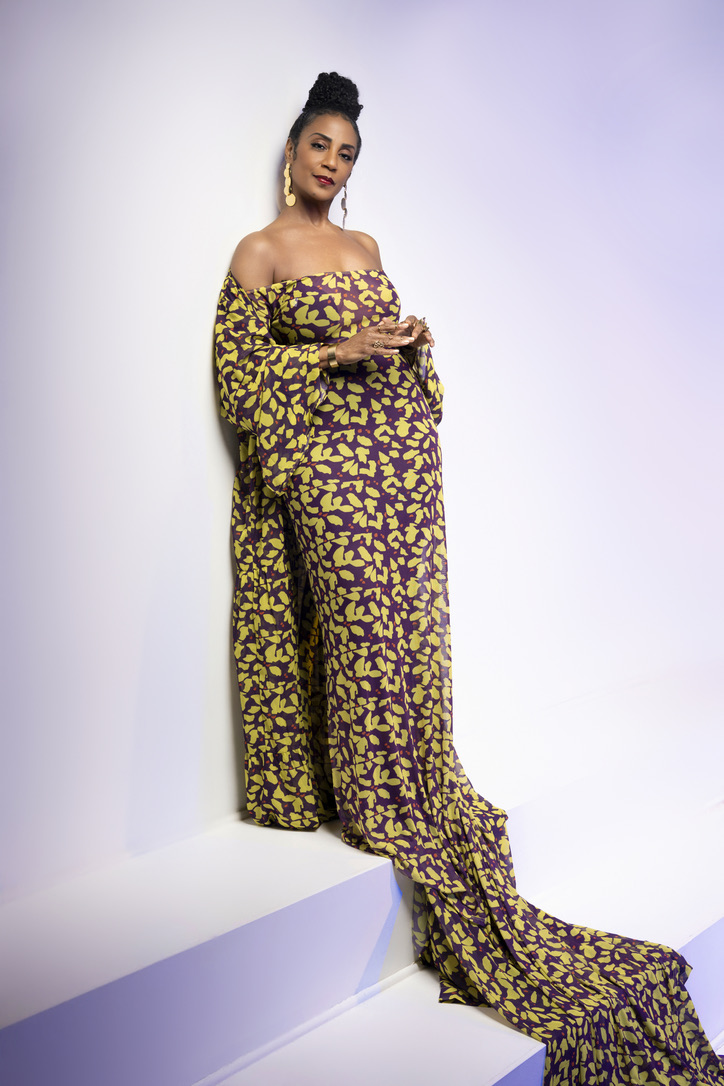 Yvette Spears wearing a plum and gold patterned gown