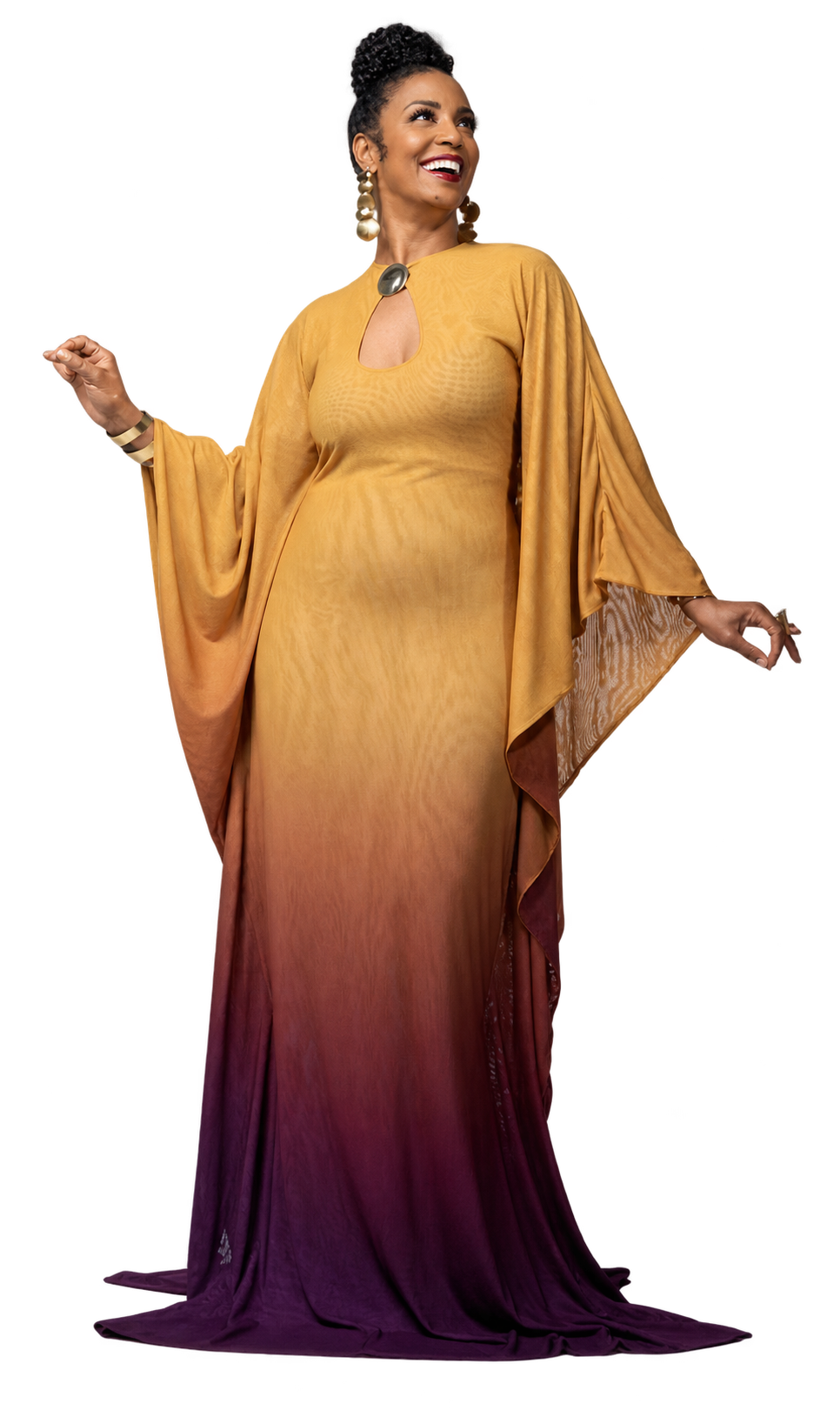 Yvette Spears smiling in a flowing gold and plum gown